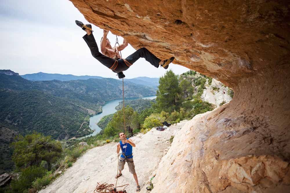 man preparing to catch a fall when belaying