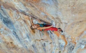 woman using heel hook climbing technique