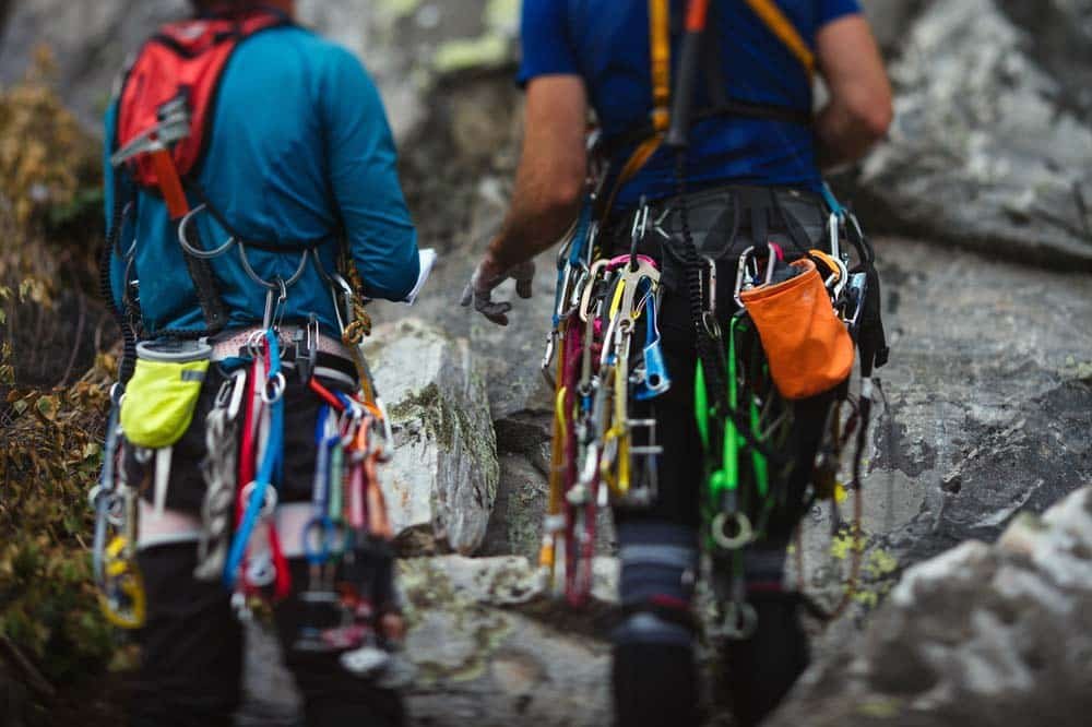 trad climbers planning a route