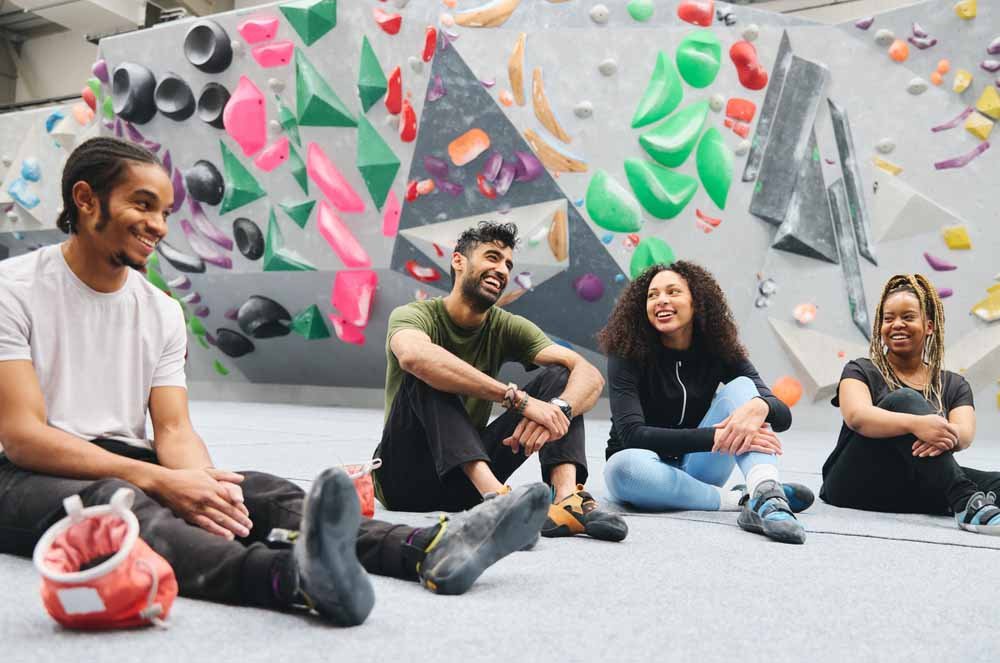 group of young people having fun bouldering