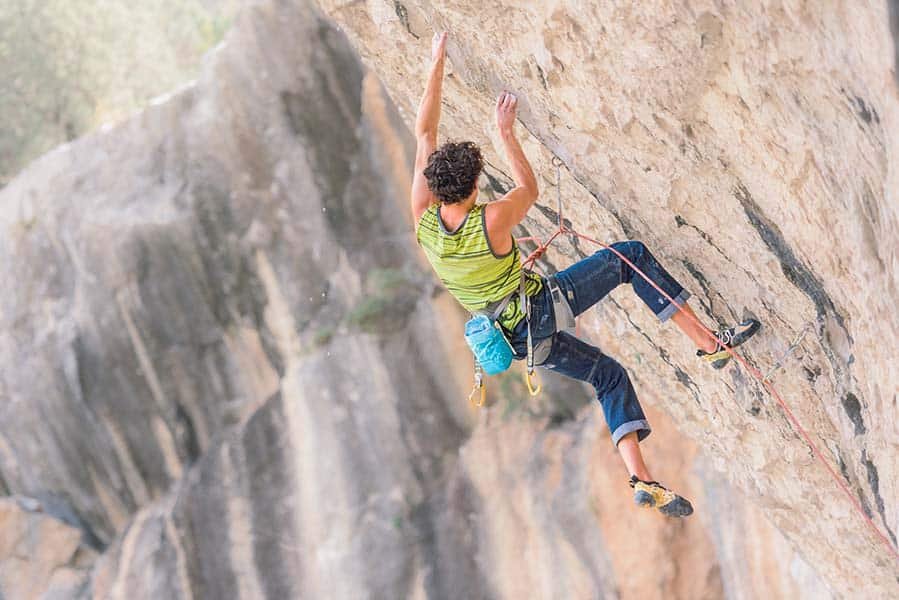 man climbing overhanging wall in costa blanca