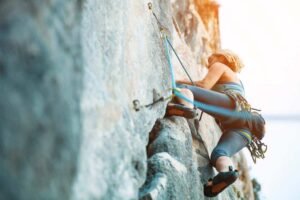 woman onsight lead climbing