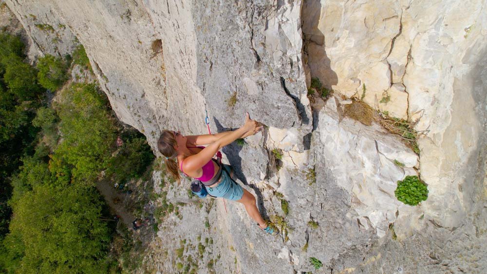 woman climber resting on flake