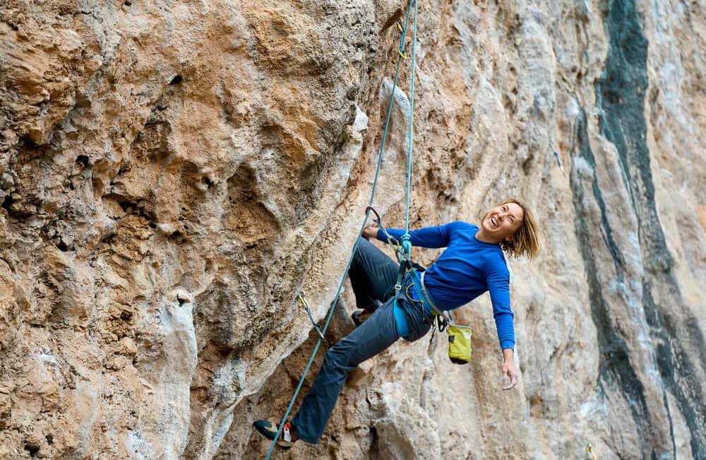 female free climber sport climbing outdoors