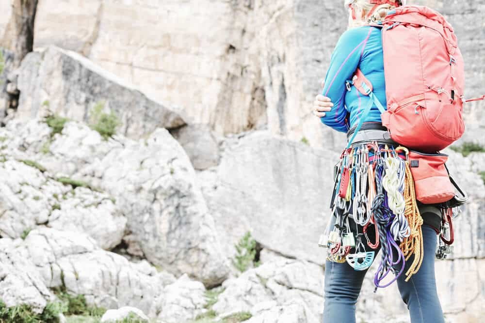 woman with trad gear on harness