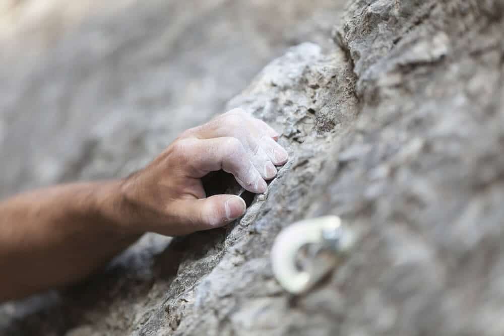 closed crimp hand grip on rock