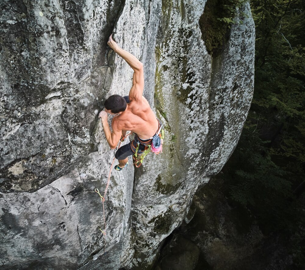 climber using flake to gaston