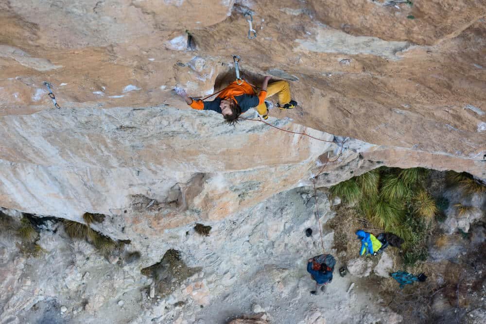 man leading technical climb