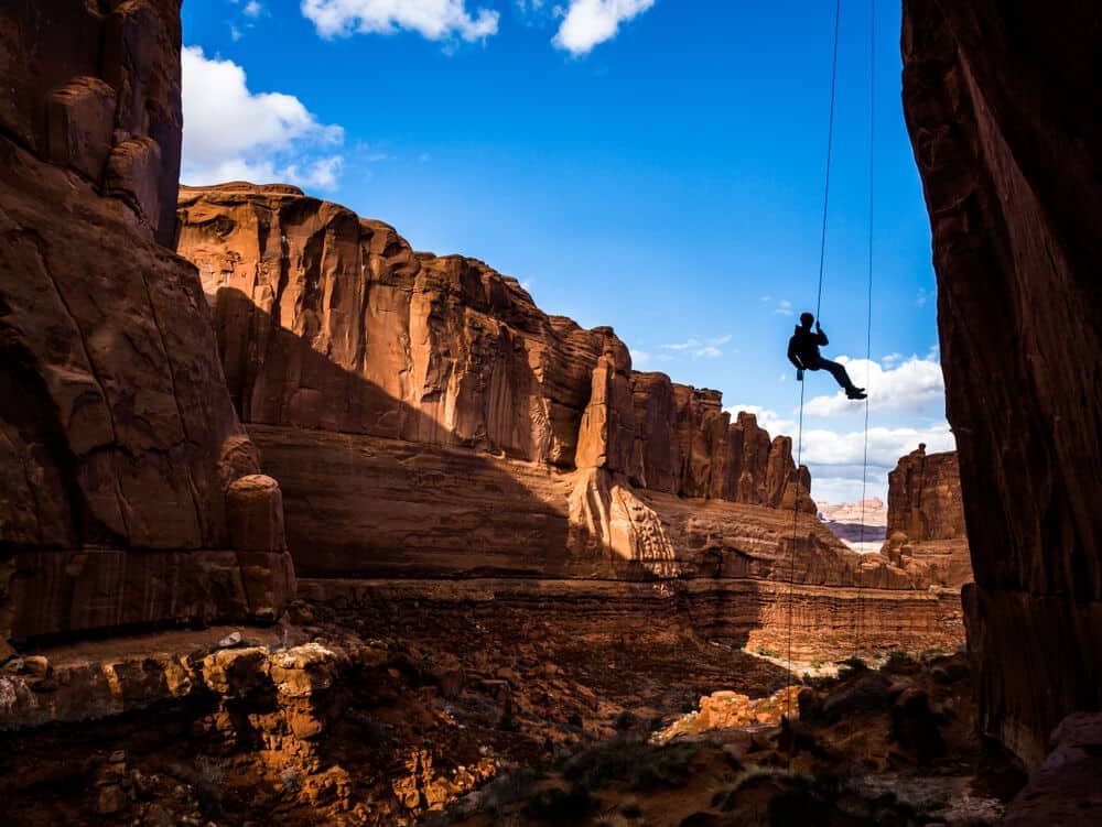 climber rappelling off climb