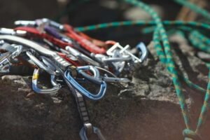 climbing quickdraws and rope on rock