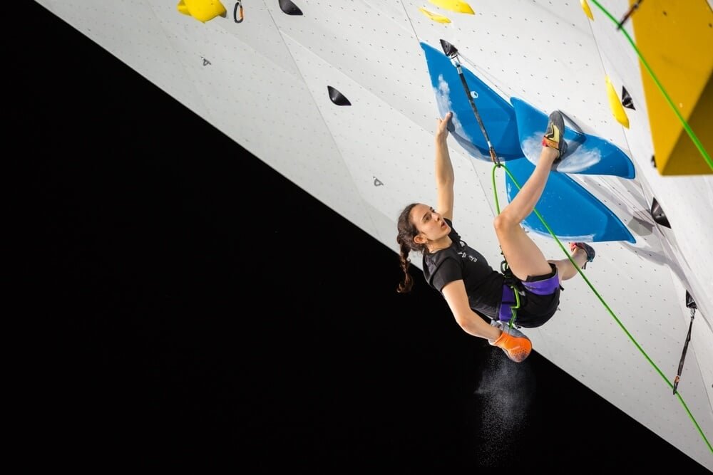 competition climber using heel hook