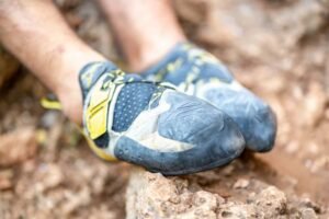 la sportiva solution climbing shoes with vibram rubber on climbers feet